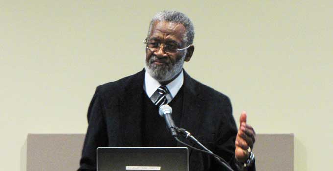 Former Chiefs plater Bobby Bell spokes at a UMKC hate crime conference. 