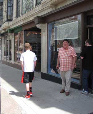 Greg Patterson in front of the block he owns on Broadway. 