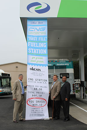 Dick Jarrold, the KCATA's vice president of regional planning and development, KCATA Board Chairman Robbie Makinen, and Interim General Manager Sam Desue highlight the savings KCATA will see with the transition to CNG fueled buses. Photo courtesy KCATA. 