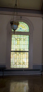 Stained glass windows surround the second floor ballroom, which is now rented out for weddings and other events.