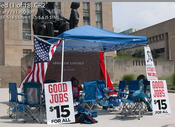 Fast food workers have set up a tent in front of city hall, where some will fast until a decision is made on the minimum wage. At noon, most of the workers participating in the fast had gone upstairs to listen to testimony before the city council on the minimum wage issue. 
