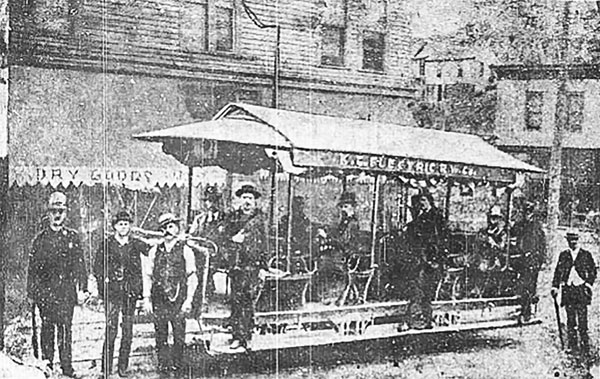 John C. Henry, second from the left, is credited for testing the first electric trolley car along Broadway Boulevard in 1884. Henry is seen in this photo, published in the Kansas City Times in 1954, along with the operator of the car, Charles F. Cobleigh, standing on the running board near the front end of the car.