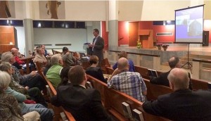 File photo. Hundreds of people have turned out for meetings about a Catholic student housing project like this one in 2015. 