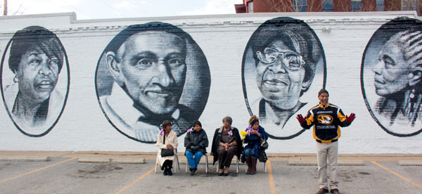 "The grandmothers of Mannheim" posing in front of their mural at 39th and Troost. 