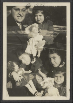 Unknown maker, American. Double Exposure: Girls with dolls and father, ca. 1945. Gelatin silver print, 3 3⁄4 x 2 1⁄2 ￼inches. Gift of Peter J. Cohen, 2015.9.111. ￼