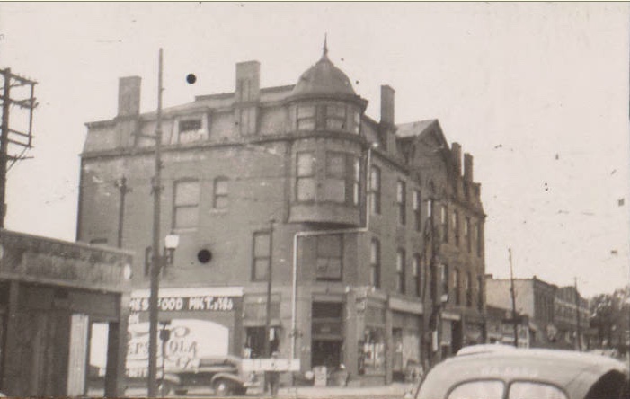 Although the buildings that once lined Thirty-first Street and wrapped around the corner on Holmes are gone now, this area was a thriving business and entertainment area in the 1920s through the 1940s. This building which stood at 3110 Holmes in this 1940 photo housed a variety of businesses during those years.